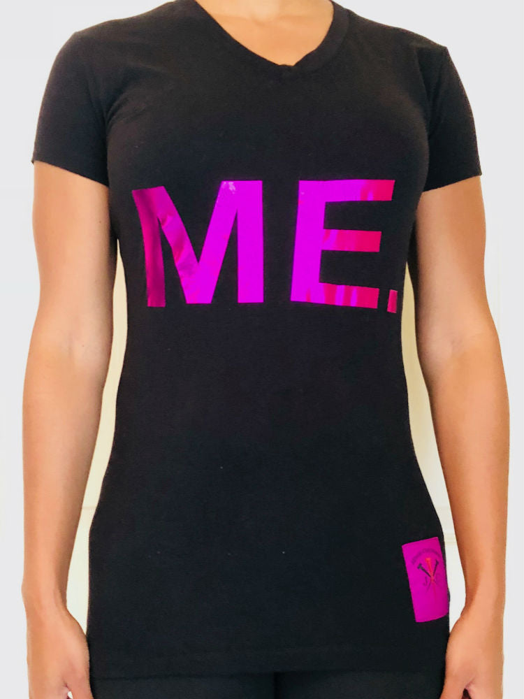 Black short-sleeved T-shirt with the word me on the front in large pink metallic letters.